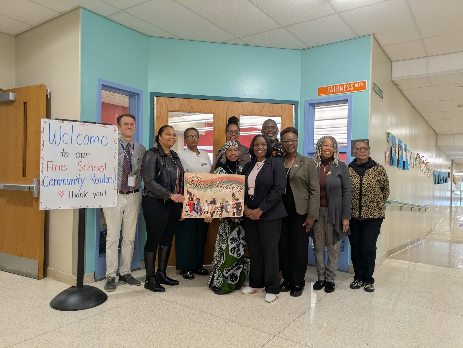 Teachers and Community leaders celebrating at Fine Elementary